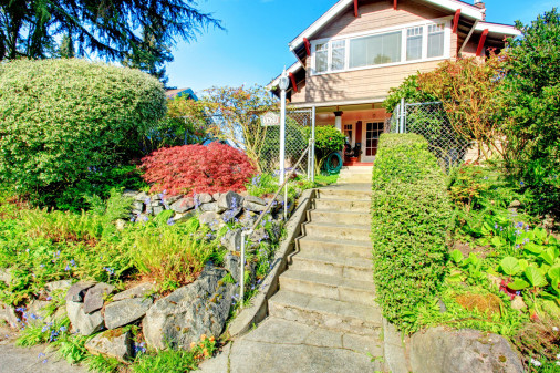 Big house with beautiful curb appeal and entrance gate